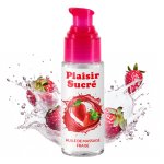 Olejek do masażu truskawkowy Plaisir Sucré otoczony soczystymi owocami i kroplami wody podkreśla swo